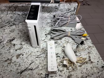 Nintendo wii console with cords & controller