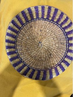 Hand-woven Purple and Natural Straw Sunburst Basket Tray .