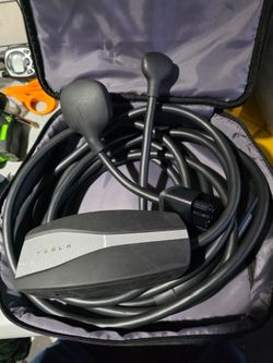 Tesla Gen 2 Mobile Connector bundle, typically including a portable charging unit, a 20-foot cable, #J