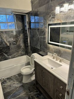 Bathroom Tile With Toilet And Beautiful Vanity 
