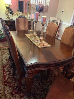 Dining room table and eight chairs.