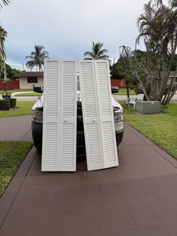 (1) Available -24"x 79.5" Plantation Louvered Solid Core, White Wood, Closet Bi-Fold Door