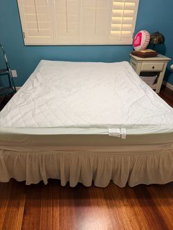 IKEA queen bed with topper