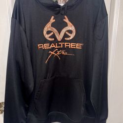 Realtree Xtra black pullover hoodie with an orange logo