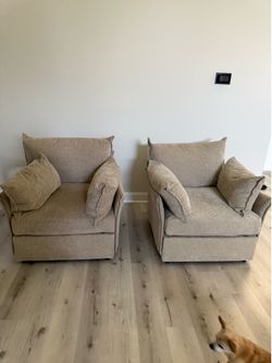Two accent chairs, turn into one loveseat