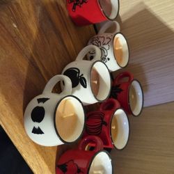 Set Of Seven Small Cup Candles