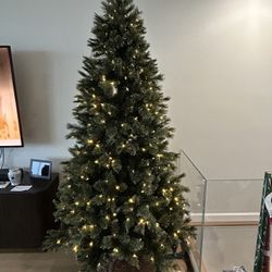 7 1/2 foot tall fake Christmas tree with lighting