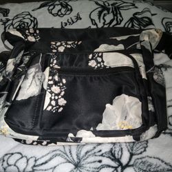 New Bla.\n Ck and white flower crossbody purse.