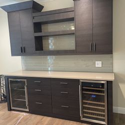 High End Bar With Two Mini Fridges And Under Counter Lighting.