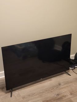 Brand new 50 inch Roku smart TV 4k OLED with wall mount accessories included