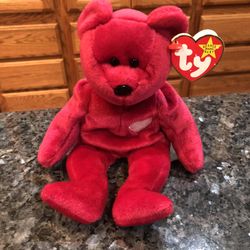 Ty Beanie Babie “Valentina” 1998.  Size  7 inches tall.  Sits  up.  Brand New with Tags th tag has 4 small tiny holes.  See pictures has been on displ