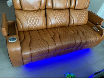 Brown leather reclining sofa