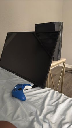 xbox console, xbox controller and tv trying to trade for a dirt bike or e bike