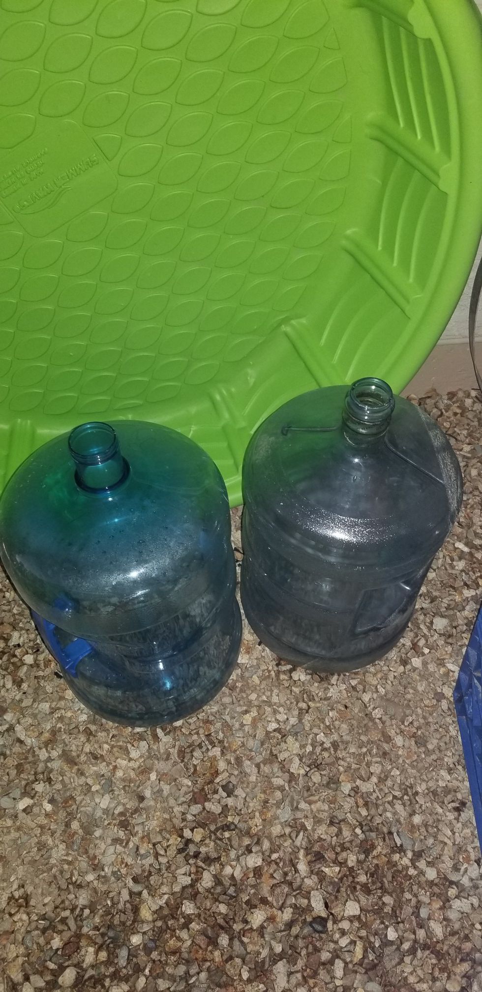 Two separate 5gal water jugs