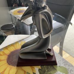Beautiful silver statue, mother, and daughter