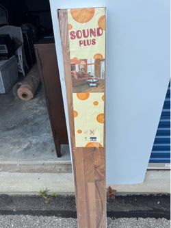 Sound Plus brand flooring featuring a medium-brown wood-look finish
