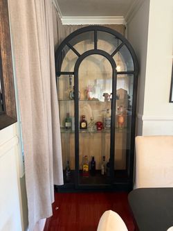 Black arched cabinet