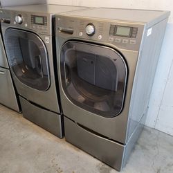 LG Front Load Washer And Stackable Gas Dryer Set With Steam And Pedestals 
