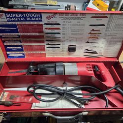 Milwaukee Heavy-Duty Sawzall reciprocating saw set, including a red steel carrying case and a blade