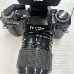 Ricoh KR-30SP 35mm SLR film camera with a Sigma Zoom-Master lens and a Promatic FA 1000 flash unit