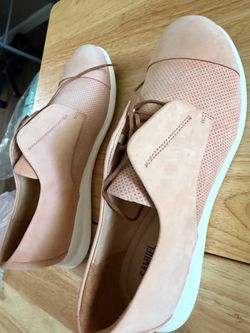Slant light pink tennis shoes