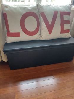 Pillows are included.  black storage ottoman bench. Size: 44X17X15