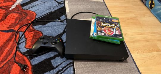 Xbox one X with one controller and three games