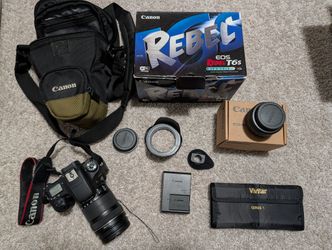 Canon T6S with 18-135mm lens, additional 50mm f/1.8 lens, Extras