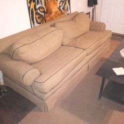 tannish sofa with brown trim