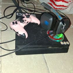 Ps4 With Head Phones And Controller 