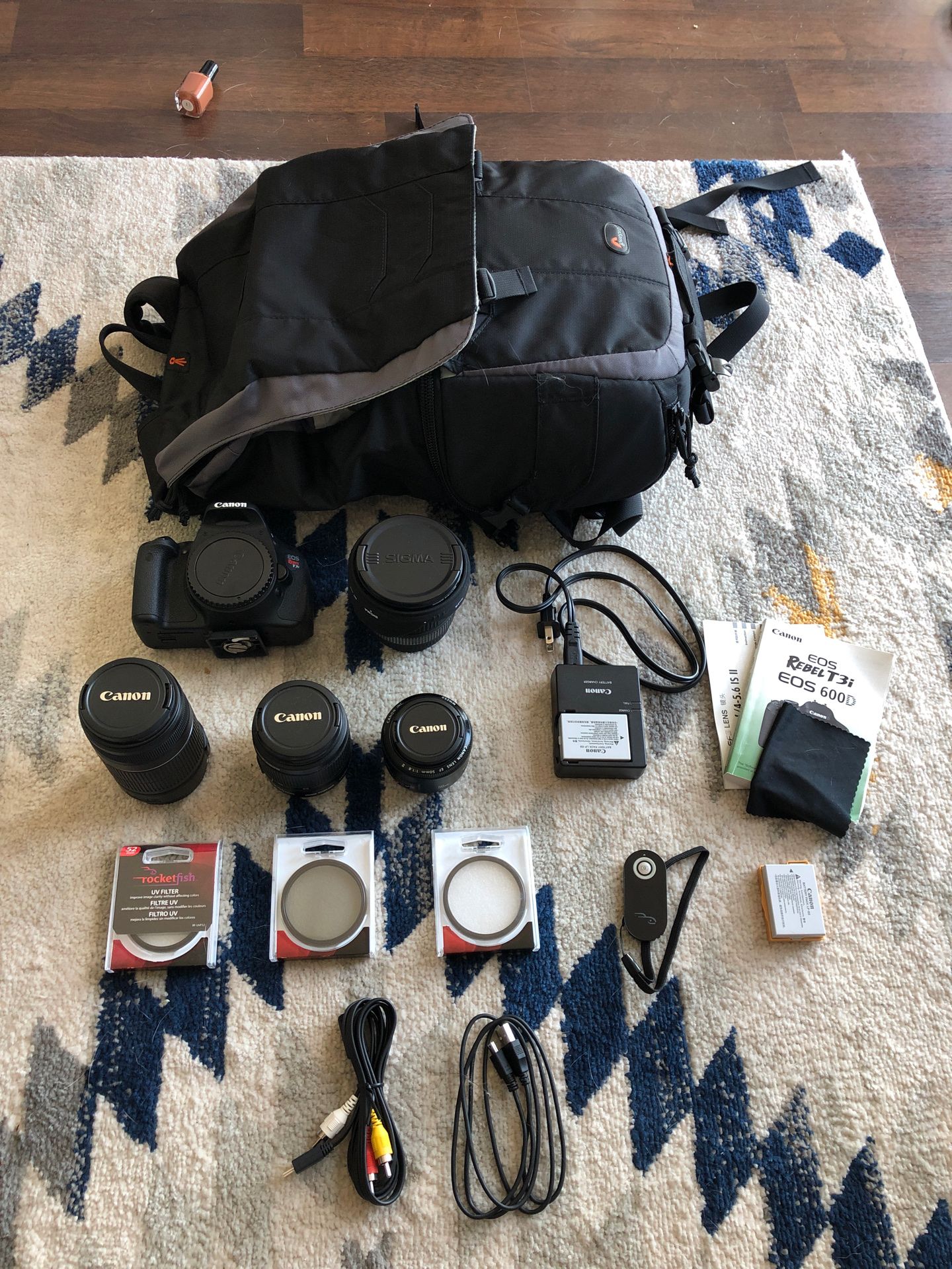 Canon T3i with several lenses and all the accessories you need