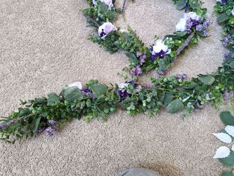 Purple white Artificial Flower Garland wreaths for table decor

Condition is used twice

Measurement
134 Inches long and 4.5 inches wide

Plant Produc