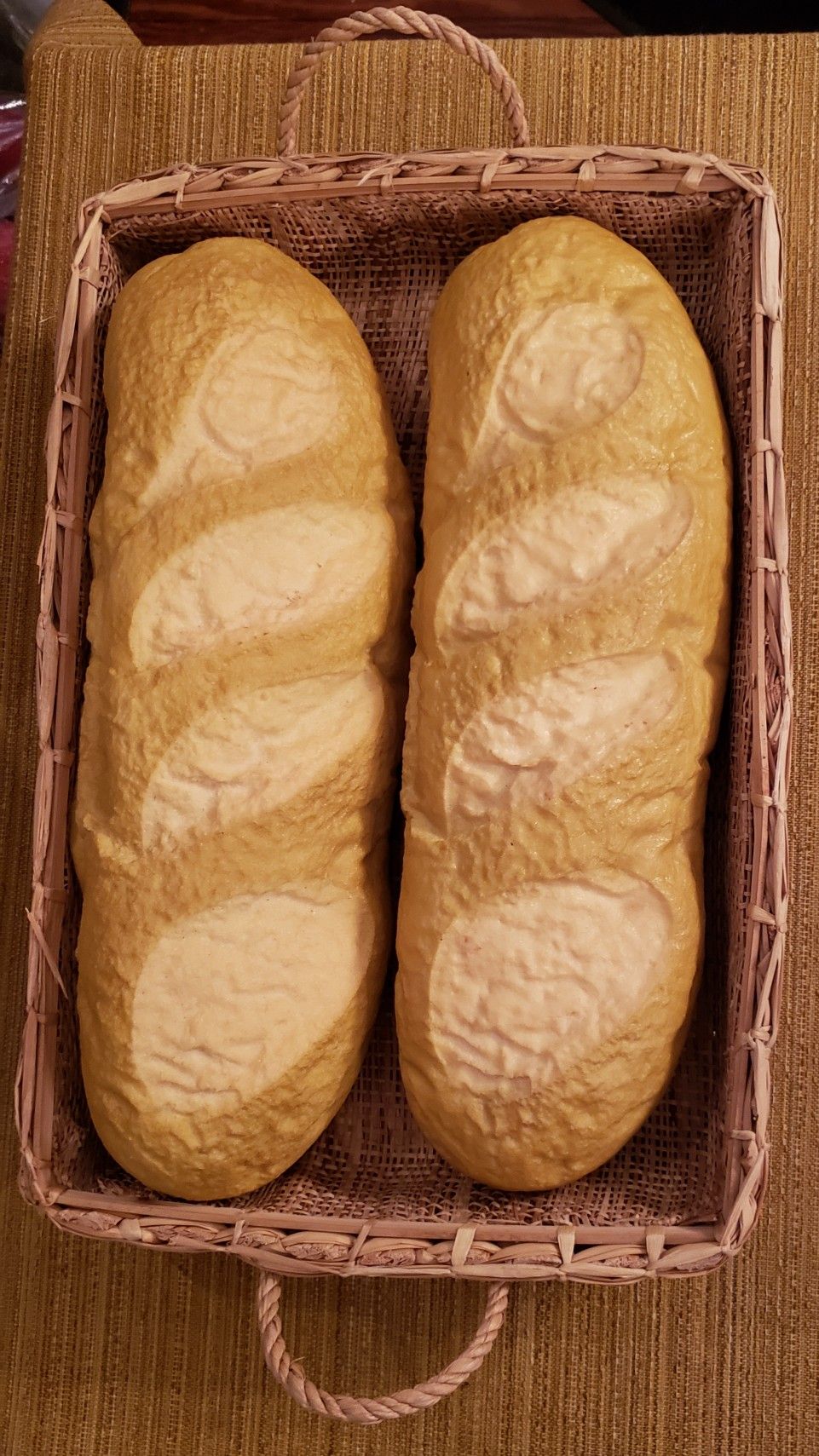 These look so real..Staging props...2 rubber loaves of bread 14x4x3 in basket 15x10x3.