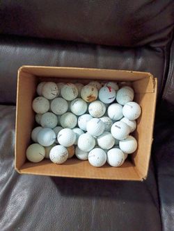 Box of old golf balls from the golf course.