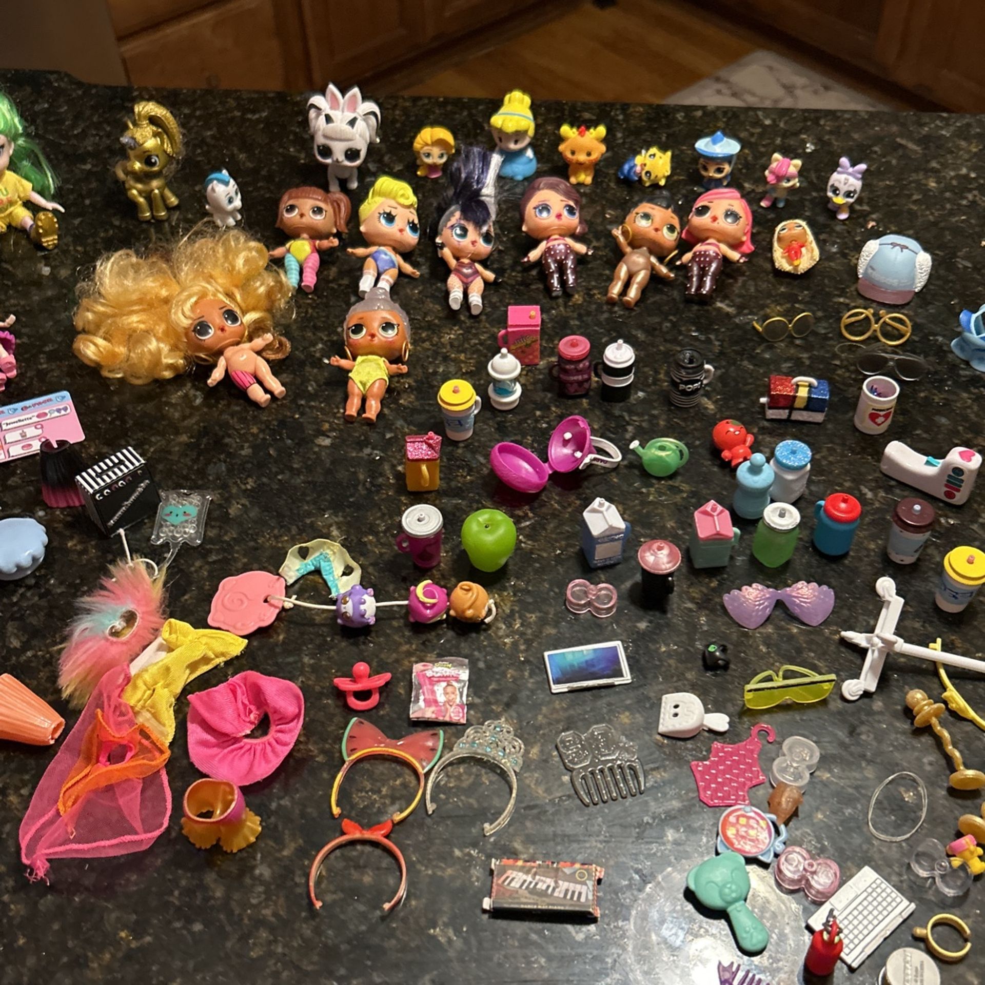 A Lot Of Different Kinds Of Little Dolls