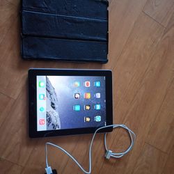 Apple IPad 16GB and Power Cord.