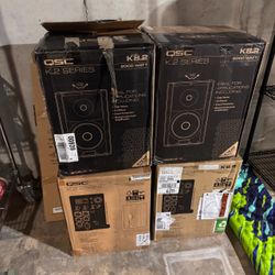 (4) QSC K8.2 2000W Powered Speakers + (4) Ultimate Support TS-90B Stands — Boxed, Like New