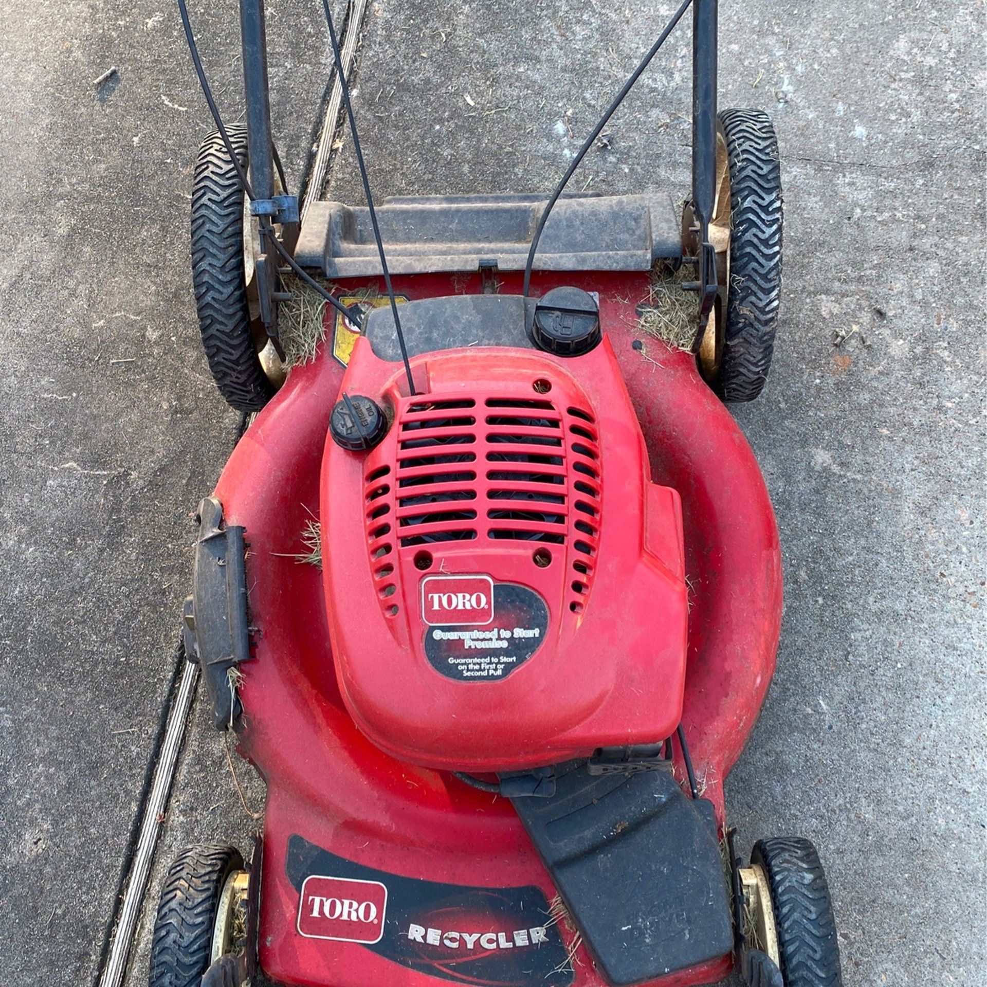 Two Running Lawn Mowers