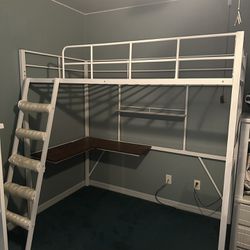 White metal twin bunk bed w/ built in desk