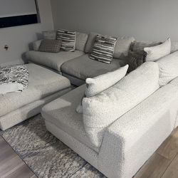 Beige Sectional With Ottoman/rug