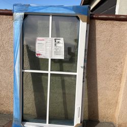 New Milgard Window with White and black Frame  measure 29/1/2 wide x 53/1/2 high