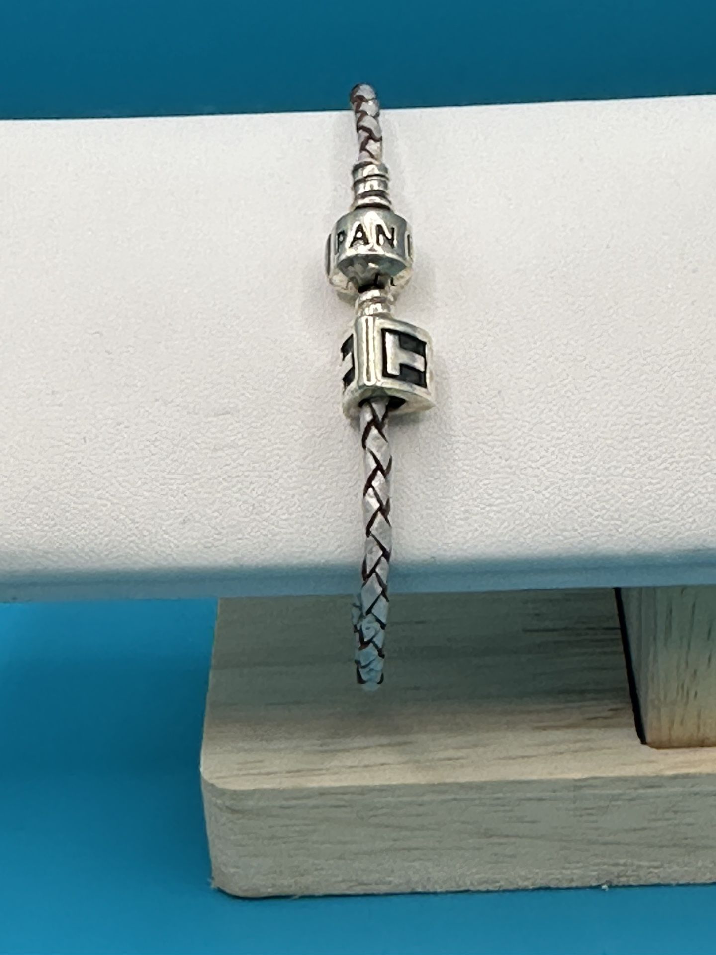 Pandora Sterling Silver Braided Bracelet With T Triangle Charm SZ 6 3/4” & Weighs 7.68 Grams Good Condition 