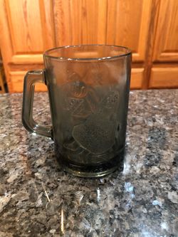 Vintage McDonald’s Gray Smoke Mug Glass.  Grimace playing Basketball.  .  Size 4 1/2 inches tall and 3, inches wide across the rim.  Capacity 4 ounces