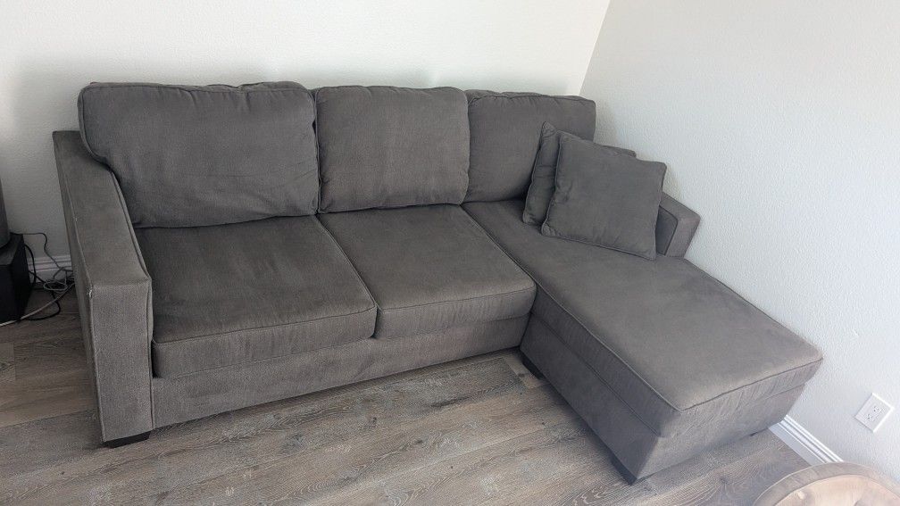Living Spaces Reversible Chaise Sofa