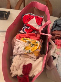 2 big bags of laundered baby girl clothes