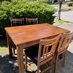 Wooden high table and four chairs