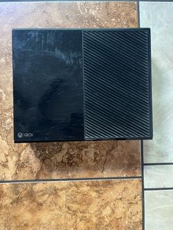 This is a black Microsoft Xbox One 500GB model 1540 gaming console.