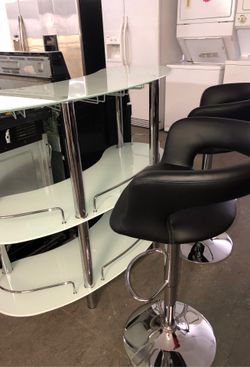 Bar table and black bar stools