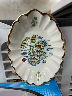 Irish souvenir map, gold trimmed oval shaped shell dish marked CARRIGCRAFT at bottom Irish souvenir map, gold trimmed oval shaped shell dish marked CA