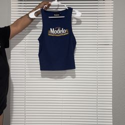 Size Medium Tank.   Runs Small.  So It Fits Like A Small 